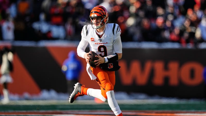 Cincinnati Bengals quarterback Joe Burrow (9) runs with the ball during the first half of an...
