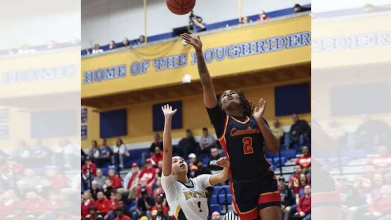 Purcell Marian's Dee Alexander drives to the basket against Notre Dame Academy's Kallie Thames...