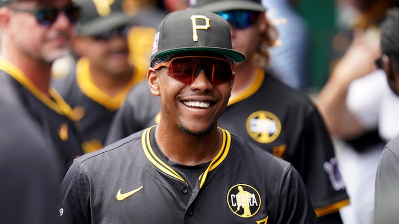 Pittsburgh Pirates' Ke'Bryan Hayes stands in the dugout before a baseball game against the...